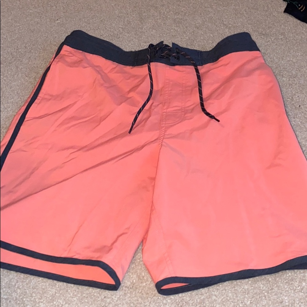 Neon orange swim shorts